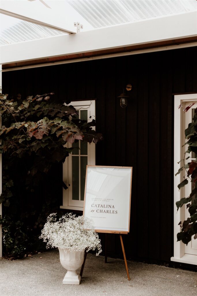 Catalina-and-Charles-Wilkinson-Wedding-DIY-Wedding-Sign-Gypsophila-Urn-Mudbrick-New-Zealand-Wild-Folk-Photography